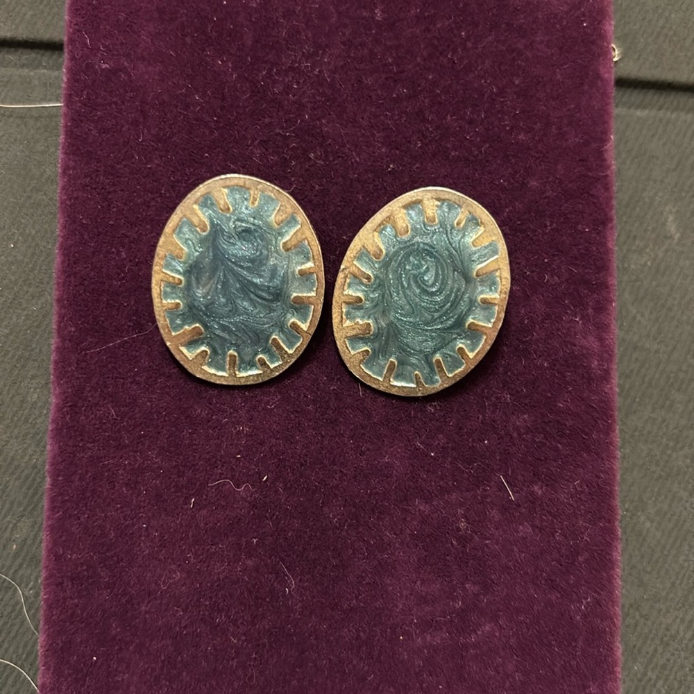 Silver earrings with blue glitter interior